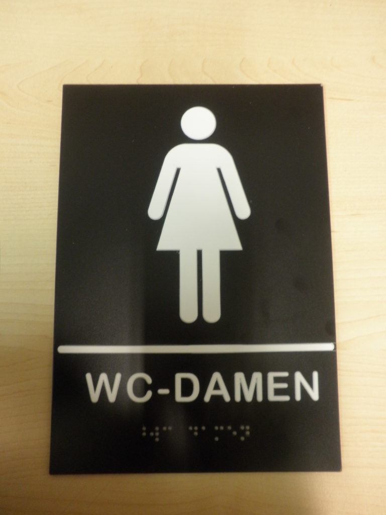 Bild Wc-Damen-schwarz-mit-weissem-Piktogramm-Tastbar